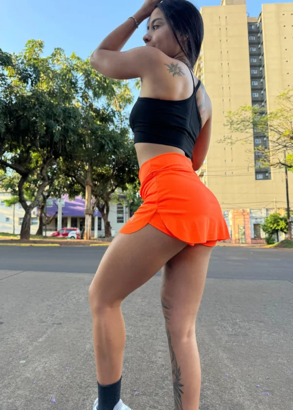 Shortpollera naranja flúor